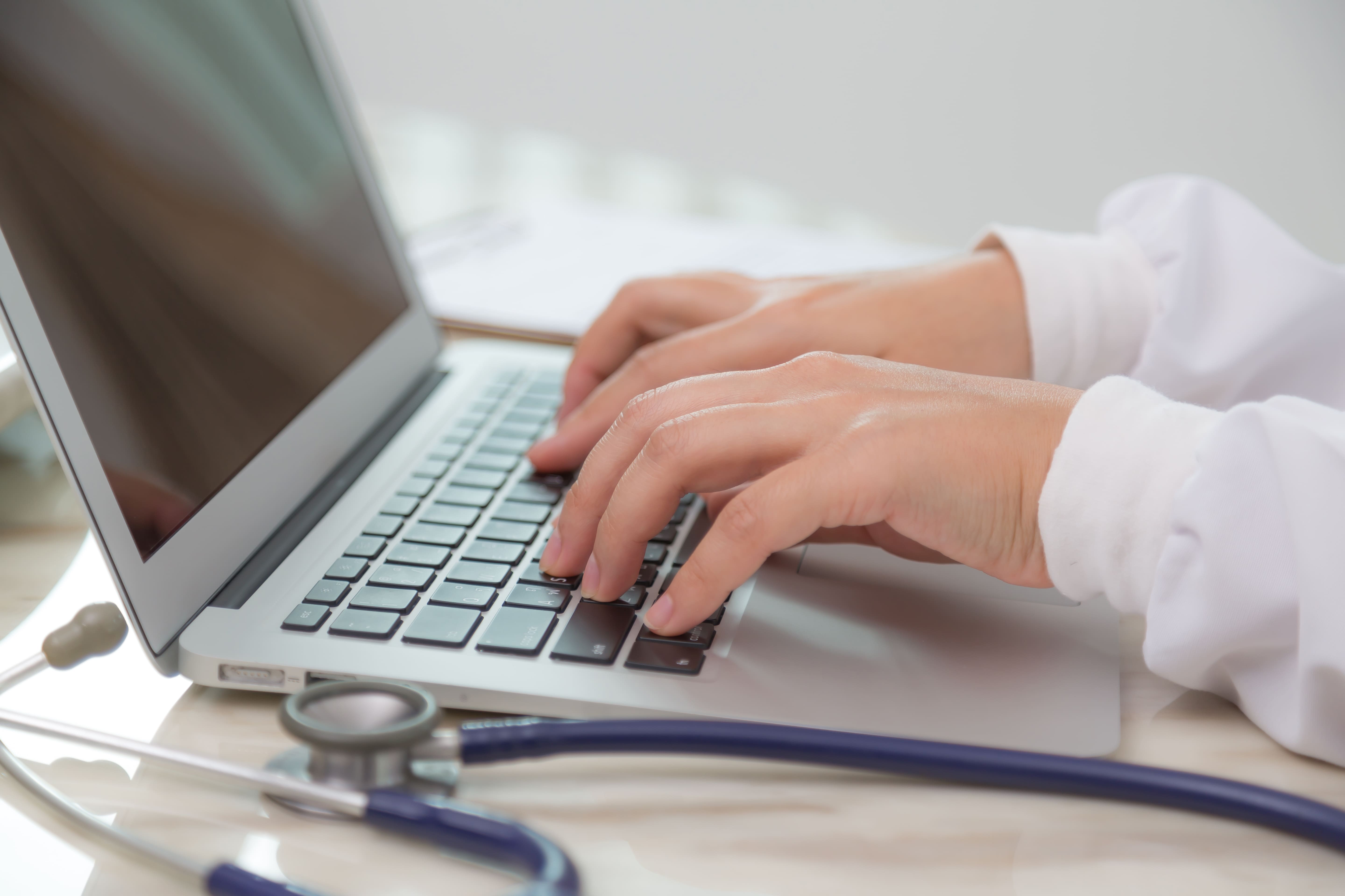 busy-doctor-using-her-laptop